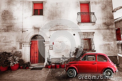 Old vintage italian scene. Small antique red car. Aging effect Stock Photo