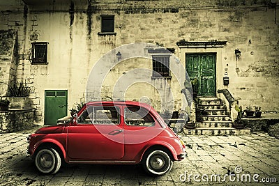 Old vintage italian scene. Small antique red car. Aging effect Stock Photo