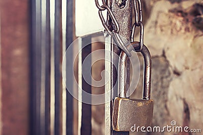 Old vintage lock with chain on iron gate. concept of reliability and safety. Old lock close-up. Close lock Stock Photo