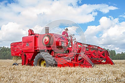 A old vintage Massey Ferguson 400 combine harvesters Editorial Stock Photo