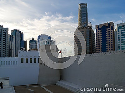 Old vintage Middle Eastern building and towers surrounded by modern skyscrapers - Qasr Al Hosn in Abu Dhabi city Editorial Stock Photo