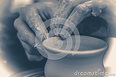 Old vintage photo. The potter molds clay jug pot Stock Photo