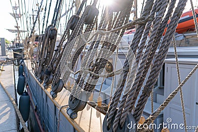 Old vintage pulley system with rigging ropes Stock Photo