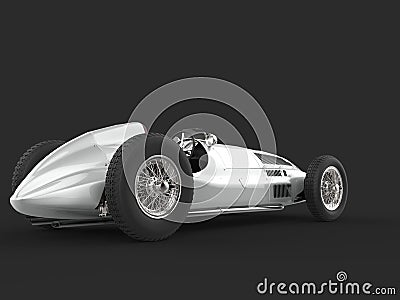 Old vintage race car in metallic silver color - back view Stock Photo