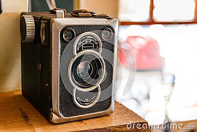 Old Vintage Retro Box Camera staying at the left side Stock Photo