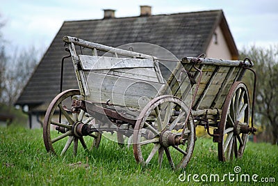 Old vintage rural rusty Amish timber open wagon. Pulled pushed vehicle for transporting hey, crops, or people. Stock Photo