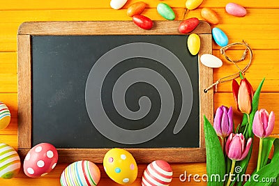 Old vintage slate with colorful Easter eggs Stock Photo