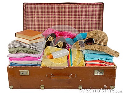 Old vintage suitcase packed with clothes Stock Photo