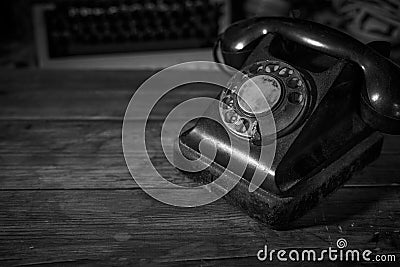 Old vintage telephone on a desk, cinematic noir scene Stock Photo