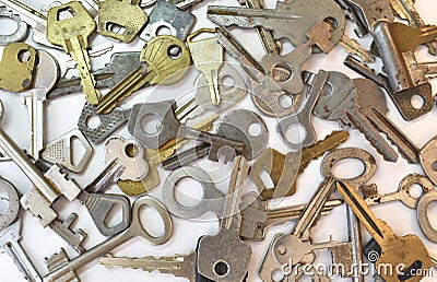 Old vintage various keys pattern. Antique metal gold bronze silver color different clue for padlock. Chaotically mix Stock Photo