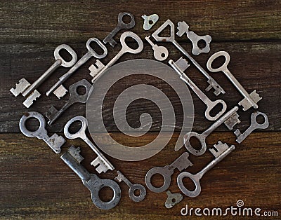 Old vintage various keys pattern. Antique metal gold bronze silver color different clue for padlock. Flat lay top view Stock Photo