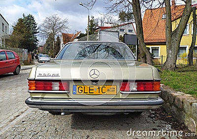 Old vintage veteran classic German car Mercedes Benz 230 CE C123 coupe parked in Gdansk, northern Poland Editorial Stock Photo