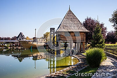 Old vintage water mill by the lake in ethno village Stanisici near the Bijeljina Editorial Stock Photo