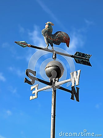 vintage weathercock in iron on blue sky background Stock Photo