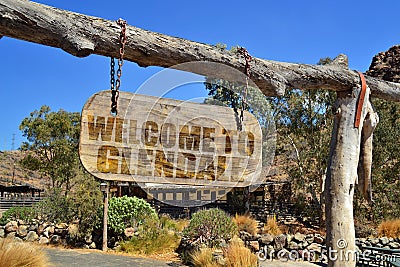 old wood signboard with text welcome to Glendale. hanging on a branch Stock Photo