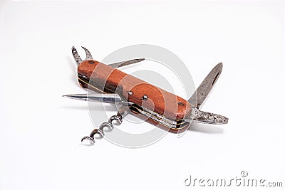 Old vintage wooden handle Swiss army multipurpose pocket knife close up shot isolated on white Stock Photo