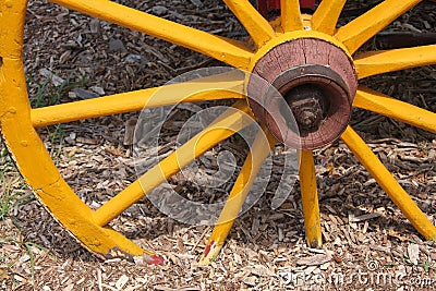 Old yellow wagon wheel Stock Photo