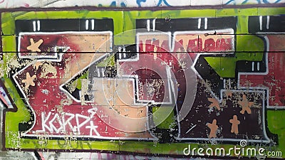 The old wall painted in color graffiti drawing green and red aerosol paints Editorial Stock Photo