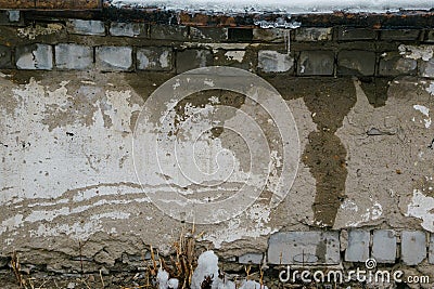Old wall wet from melting snow Stock Photo