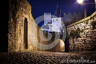 Old walled citadel at night. Carcassonne. France Stock Photo