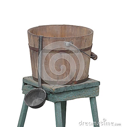 Old water bucket and dipper isolated. Stock Photo