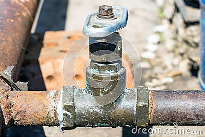 Old Water Tap on a Rusty Pipe Stock Photo