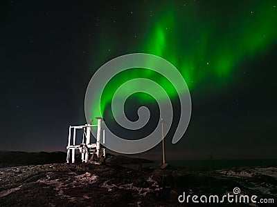 Old weather station. Winter Teriberka. Evening polar landscape with the Aurora Borealis Stock Photo