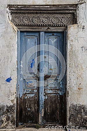 Old weathered carved traditional zanzibarian door Stock Photo