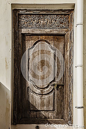 Old weathered carved traditional zanzibarian door Stock Photo