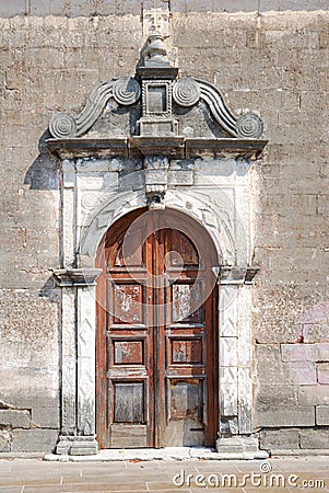 Old weathered door of a small greek church Stock Photo