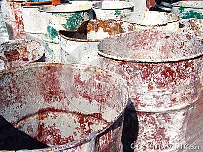 Empty industrial oil drums exposed to the sun Stock Photo