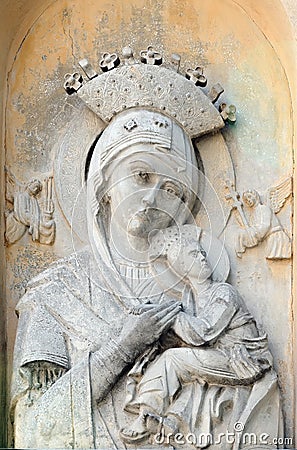 Old stone relief of Our Lady of Perpetual Help Church in Lviv Ukraine Stock Photo