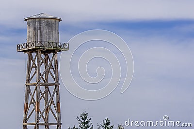 Old weathered wood beam water tower Stock Photo