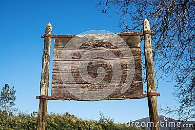 Old weathered wooden sign Stock Photo