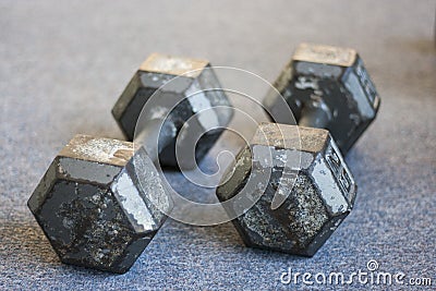 Old weights on carpet floor Stock Photo