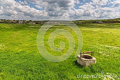 Old well casing on meadow. Iurievca, Gagauzja, Republic of Moldova Stock Photo
