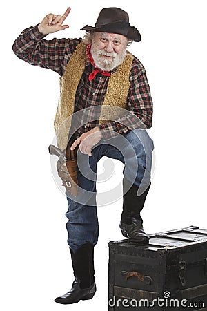 Old West cowboy leans forward pointing up Stock Photo