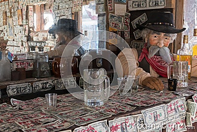 Dollar bills cover an old west saloon Editorial Stock Photo