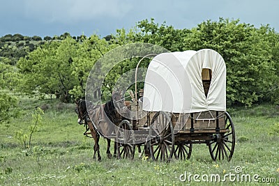 Old western covered wagon in Texas plains Stock Photo