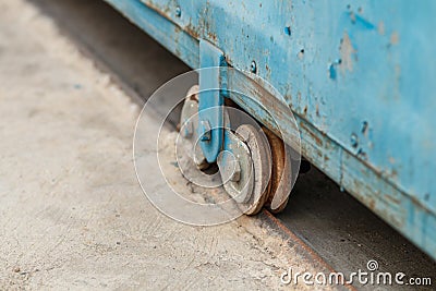 Old wheel of metal slide door Stock Photo