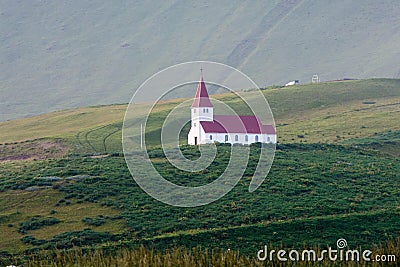 Old white church with red roof on a hill, Iceland Stock Photo