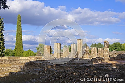 Old white columns and ruined square in ancient roman city Italica, Sevile, Spain Stock Photo