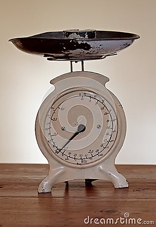 An old white scale made of iron with handwritten numbers Stock Photo