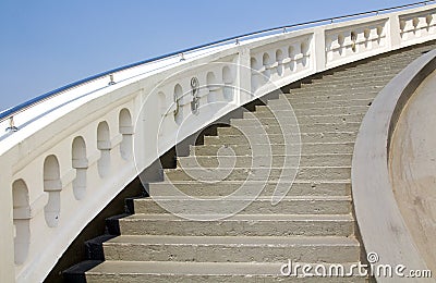 Old white stone circular stairs case Stock Photo