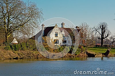 Old white villa along river Lys in Flanders, Belgium Editorial Stock Photo