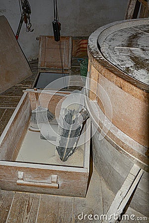 An old windmill grinding wheat Stock Photo