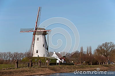 Old windmill near Damme dring winter Stock Photo