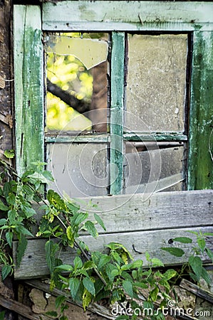 Old window with broken glass Stock Photo