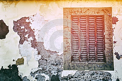 Old window with cracky wooden shutters Stock Photo