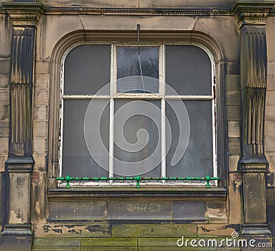 Old window frame sand stone building Stock Photo